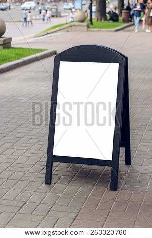 Wooden Dark Restaurant Signboard On Street With Place For Your Text On It
