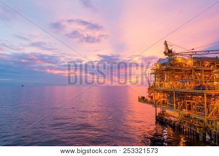 Offshore Construction Platform For Exploration And Production Oil And Gas With Bridge In Evening Tim