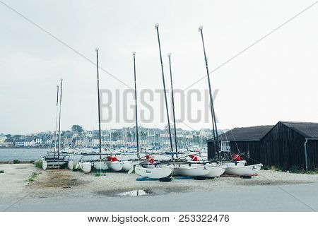 Morgat, France 29 May 2018 Catamarans Storage Without Sails Parked On The Beach.