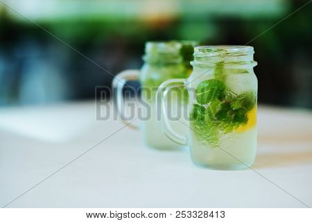Lemonade From Lime With Mint, Mohito, With Ice, Glass Jar, Mason Jar, In City Cafe.