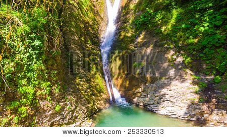 Drone View Of Orekhovsky Waterfall And Vegetation On The Steep Rock In Sunny Summer Day, Sochi, Russ