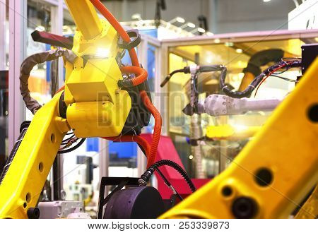 Industrial Line With Yellow Robots On Sides, Production And Processing Of Metal Parts, Slective Focu