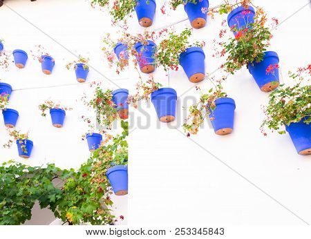 Poble Espanyol Cortyard Details, With Traditional For Andalusia White Walls And Blue Pots Architectu