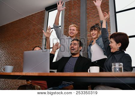 Business Concept. Businessmen Are Shouting With Joy. Business People Are Raising Their Hands For Bus