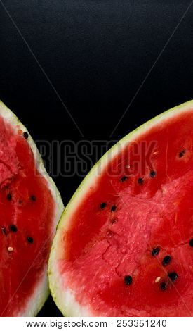 One Watermelon Cut In Halves Isolated On Black Background With Clipping Path