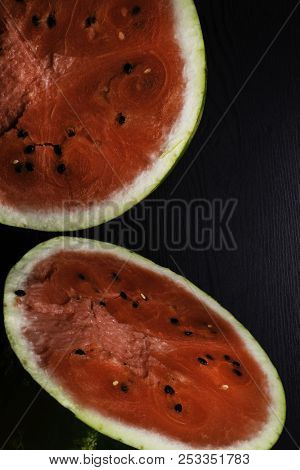 One Watermelon Cut In Halves Isolated On Black Background With Clipping Path