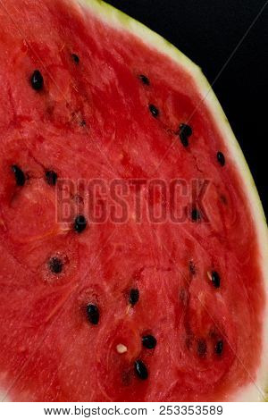 A Half Of Fresh Watermelon Isolated On Black Background.