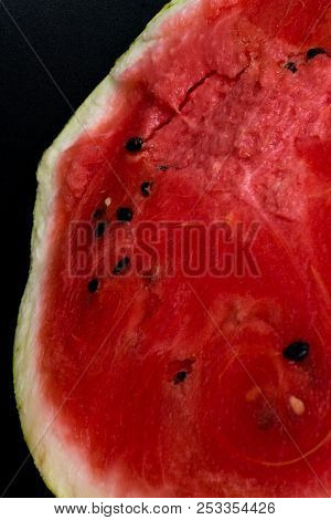 A Half Of Fresh Watermelon Isolated On Black Background.