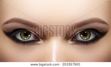 Closeup Female Eyes With Bright Make-up, Great Shapes Brows, Extreme Long Eyelashes. Celebrate Makeu