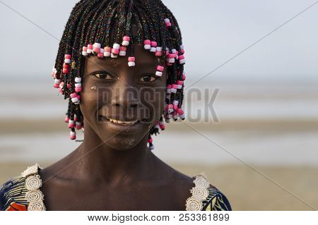 Orango Island, Guinea-bissau - February 2, 2018:  Portrait Of A Beautiful Young Girl In The Beach In