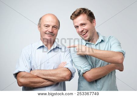 Senior Father Is Proud Of His Mature Son.