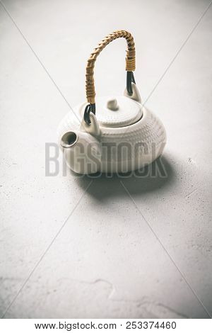 Ctramic Teapot On Concrete Background- Healthy Life And Relaxation Concept