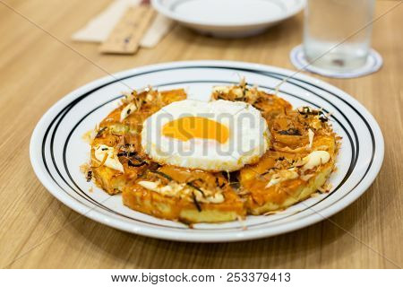 Okonomiyaki, Japanese Pizza On The Wooden Table.