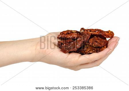 Sun Dried Red Tomatoes With Hand Isolated On White Background
