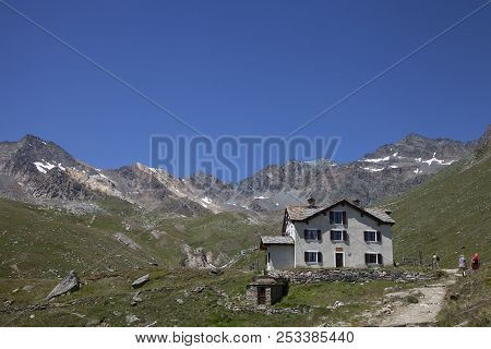 Valnontey, Italy, 29 July 2018: People Hike Near Rifugio Vittorio Sella In The Mountains Of Italian 
