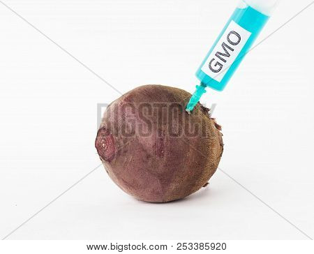 Beetroot On A White Background In Which Is Injected From The Syringe Gmo And Nitrates, Close-up, Bee