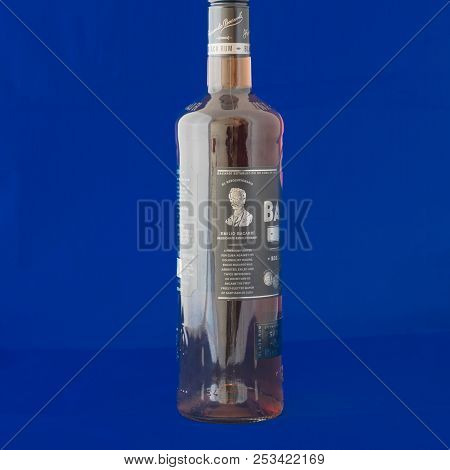 Studio Shot A Bottle Of Bacardi Black Rum Isolated On Blue Background