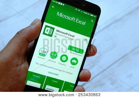 Bandar Seri Begawan,brunei - July 25th,2018 : A Male Hand Holding Smartphone With Microsoft Excel Ap
