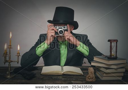 Secret Service Spy Agent Take A Picture With Photo Film Camera In His Hands. Detective Or Spy Agent 