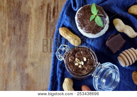 Peanut Urbech With Chocolate Surrounded By The Ingredients. Top View. Copy Space