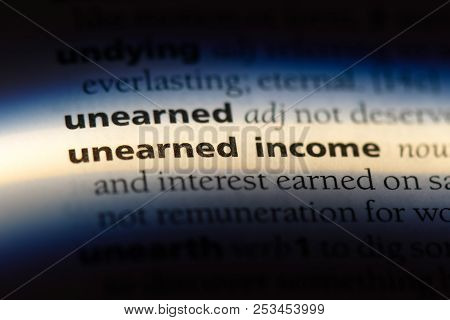 Unearned Income Word In A Dictionary. Unearned Income Concept.
