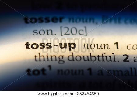 Toss Up Word In A Dictionary. Toss Up Concept.
