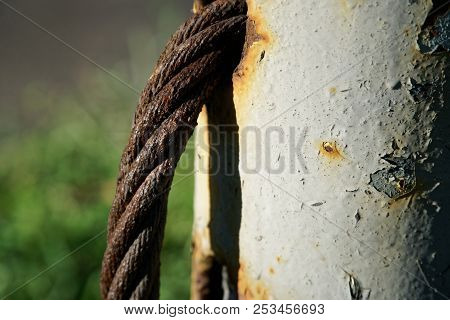 Thick Steel Rope Close Up. Bridge Fence Element. Detailed View. The Surface Of The Steel Cable Is Co