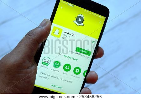Bandar Seri Begawan,brunei - July 25th,2018 : A Male Hand Holding Smartphone With Snapchat Apps On A