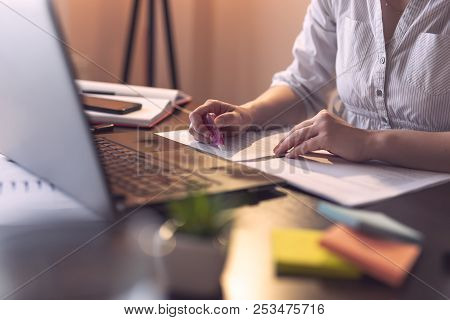 Businesswoman Using An Ink Corrector