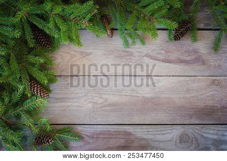 Christmas Firbranch With Cones On Old Wooden Rustic Background With Copy Space For Text.