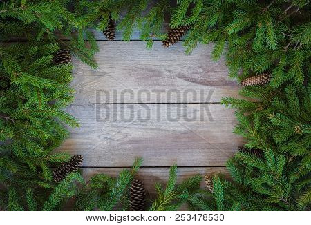 Christmas Firbranch With Cones On Old Wooden Rustic Background With Copy Space For Text.