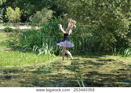 Ballerina Made Of Cloth Over The Water