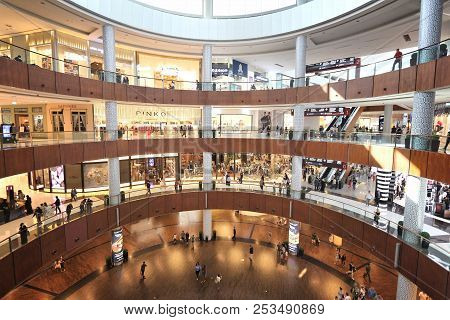 Dubai, Uae - November 22, 2017: Shoppers Visit Dubai Mall. It Is The Largest Mall In The World By To