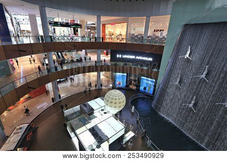 Dubai, Uae - November 22, 2017: Shoppers Visit Dubai Mall. It Is The Largest Mall In The World By To