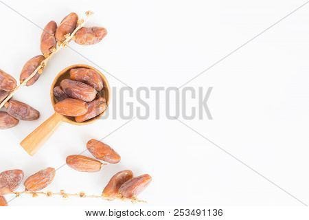 Dates Fruit In Wooden Ladle On White Background,dried Date Palm Fruits Top View
