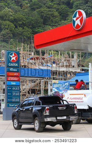 El Nido, Philippines - December 2, 2017: People Fill Cars At Caltex Gas Station In El Nido, Philippi