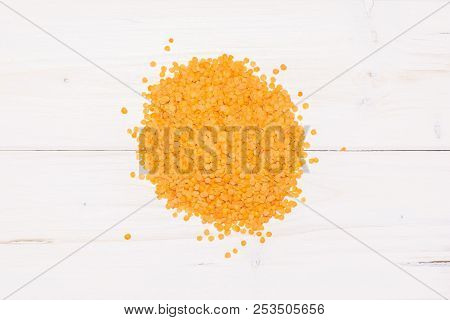 Lot Of Whole Raw Red Lentils Heap Flatlay On Grey Wood