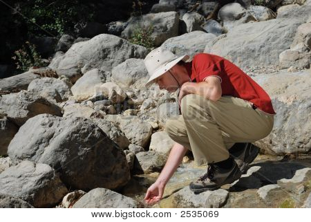 Man Having A Break At A Mountain River