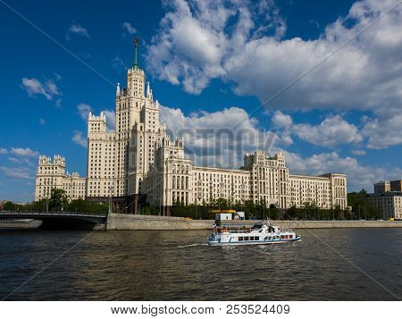 Moscow, Russia - May 12. 2018. Boat On Moskva River Opposite House On Kotelnicheskaya Embankment