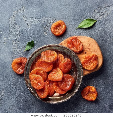 Dried Apricots On Gray Background With Copy Space. Top View.