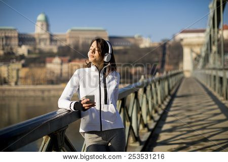 Young Athlete Woman With Mobile Phone Outdoor