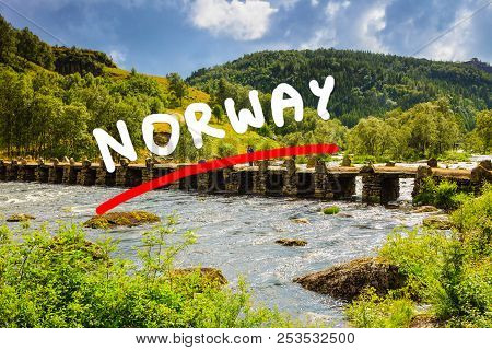 Tourist Woman Standing On Stone Slab Bridge Terland Klopp In Norway Dalane Region.