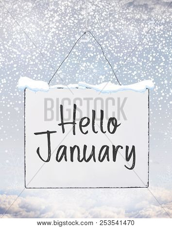 Hello January Text On White Plate Board Banner With Cold Snow Flakes Qoute