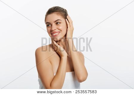 Happy Beautiful Girl Holding Her Cheeks With A Laugh Looking To The Side. Expressive Facial Expressi