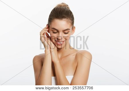 Happy Beautiful Girl Holding Her Cheeks With A Laugh Looking To The Side. Expressive Facial Expressi