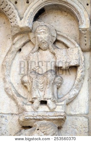 MODENA, ITALY - JUNE 04: Plate with stories from Genesis: Story about Abel and Cain, God the Father, relief by Wiligelmo, Modena Cathedral, Italy on June 04, 2017.