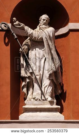 MODENA, ITALY - JUNE 04: Saint Barnabas statue on the portal of St. Barbabas Church, Italy on June 04, 2017.