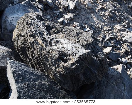 Textured Obsidian And Hardened Lava Rock On A Sunny Fall Day At The Big Obsidian Flow In The Newberr