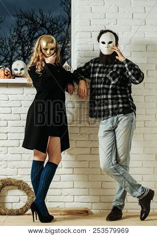 Girl And Man In Mask Stay At Window. Carnival, Masquerade, Masque Party, Holiday Celebration. Decora
