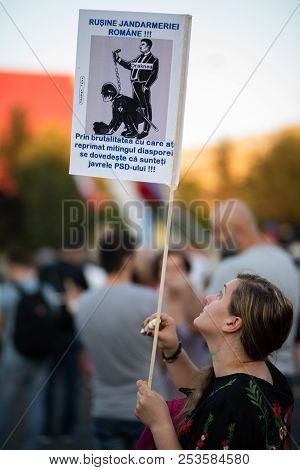 Romania, Bucharest - August 12, 2018: Protester Holding Sign And Teardrops After The Citizens Were G
